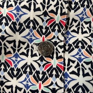 Button front jacket in playful dragonfly print.
